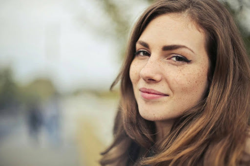 A close-up of a woman who has taken control of her symptoms with an effective POTS management plan.