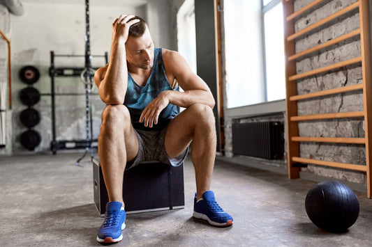 A man feeling fatigued while exercising due to the effects of low electrolytes.