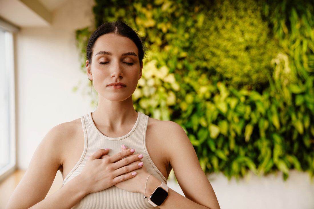 A woman experiences rapid heart rate as a symptom of blood pressure fluctuation in POTS.
