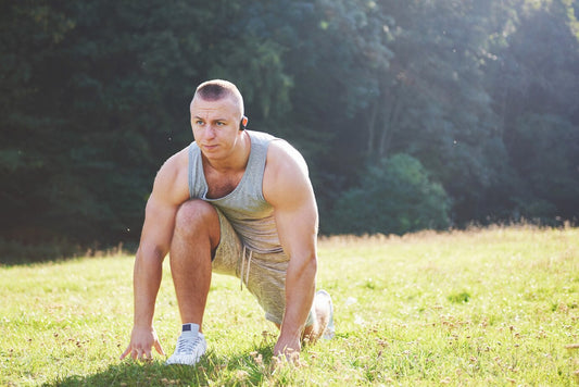 A young sportsman getting ready for athletic and fitness training outdoors.