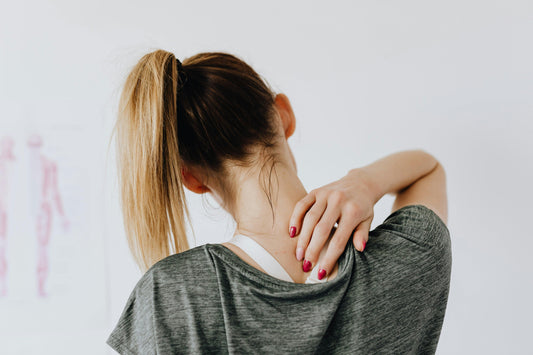 A woman experiences pain in her shoulder caused by Postural Orthostatic Tachycardia Syndrome (POTS).