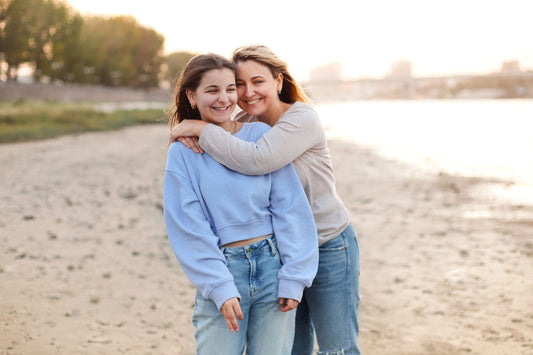 A woman and her daughter enjoy a day at the beach, illustrating the potential hereditary connection in POTS.