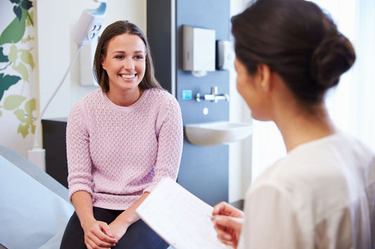 A woman talks with her doctor about her POTS symptoms.