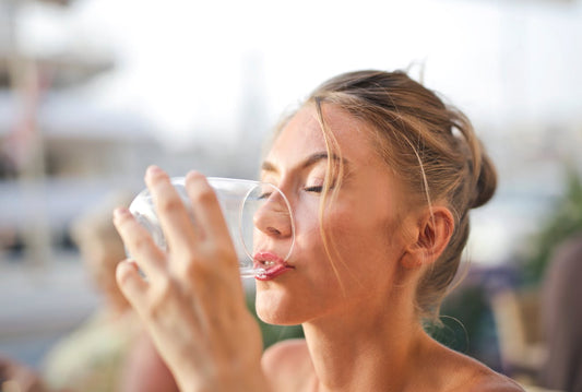 Women drinking water from a glass