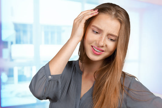 Concerned woman with head pain