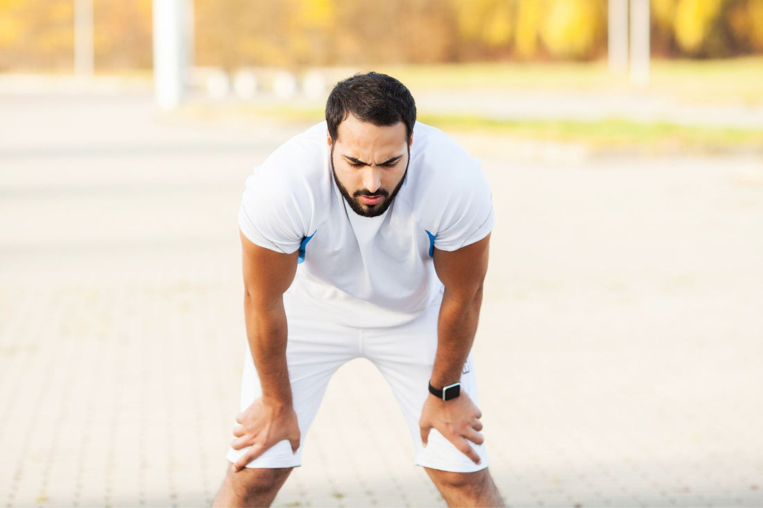 A man with POTS, taking a break while exercising.